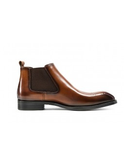 Brown Chelsea boots in cowhide leather with brogue details, side elastics, and back pull tab.