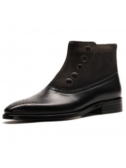 Black leather and suede ankle boots, decorated with rivets, pointed toe, and side zipper closure.