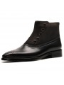 Black leather and suede ankle boots, decorated with rivets, pointed toe, and side zipper closure.