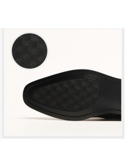 Black leather and suede ankle boots, decorated with rivets, pointed toe, and side zipper closure.