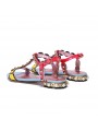 Multicolored sandals with riveted straps, open toe, buckle, and leather insole.
