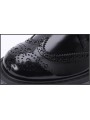 Scarpe brogue in vera pelle nera con suola trasparente, un perfetto equilibrio tra eleganza classica e modernità.