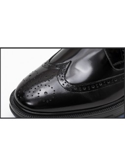 Black leather brogue shoes with a blue sole, grosgrain detail, and back tongue for a sophisticated touch.