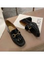 Black patent leather loafers with a mid heel and metal bit detail. Leather insole and rubber outsole for maximum comfort