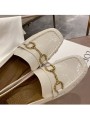 White patent leather loafers with a mid heel and metal bit detail. Leather insole and rubber outsole for maximum comfort.