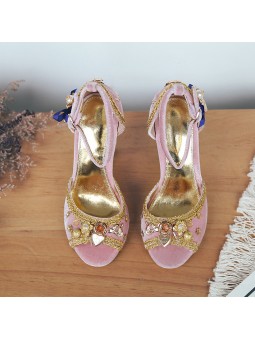 Pink velvet sandals with a high block heel, strap closure with buckle, and gold leather insole for a chic finish.