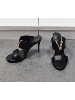 Black leather sandals with double straps and V-letter detail. A bold and refined design to enhance your look.