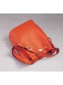 Orange grained leather bucket bag with straps and lock, gold-tone finish, and adjustable leather shoulder strap.