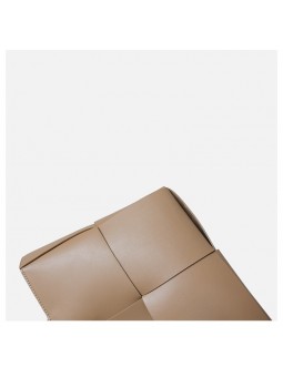 arge braided smooth leather tote bag in apricot. Gold finish and adjustable strap. Subtle freshness.