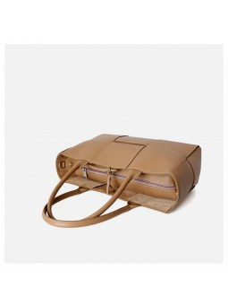 arge braided smooth leather tote bag in apricot. Gold finish and adjustable strap. Subtle freshness.