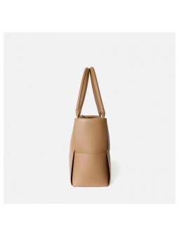 arge braided smooth leather tote bag in apricot. Gold finish and adjustable strap. Subtle freshness.