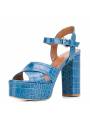 Platform sandals in crocodile-effect leather, thick round heel and round toe. A bold touch in blue.