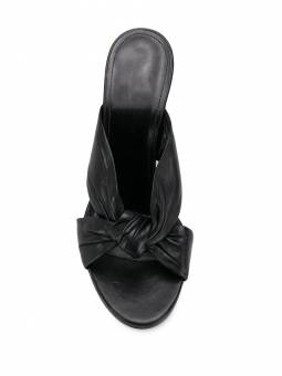 Black pleated leather mules with a thick heel and rounded toe. A perfect blend of elegance and comfort