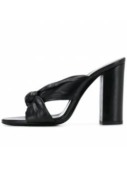 Black pleated leather mules with a thick heel and rounded toe. A perfect blend of elegance and comfort