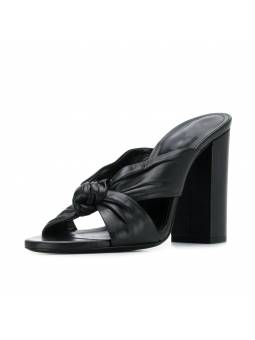 Black pleated leather mules with a thick heel and rounded toe. A perfect blend of elegance and comfort
