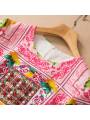 Abito estivo rosa con motivo a limoni decorato con perle e paillettes per donna