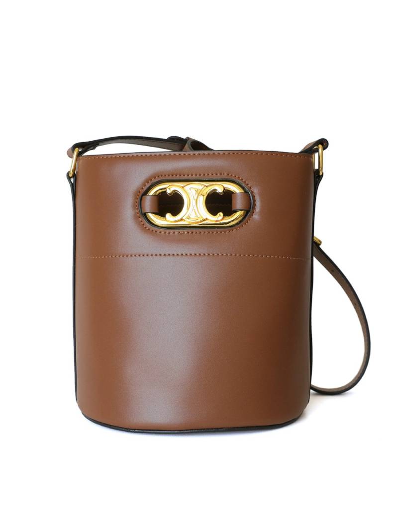 Brown leather bucket bag, with an adjustable and removable leather strap for crossbody wear. Refined gold-tone details.