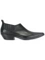 Short leather santiag boots, slip-on style with elastic sides. Pointed toe and cuban heel for a bold, trendy look