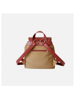 Beige two-tone women’s bag with leather handle, drawstring and belted flap closure.
