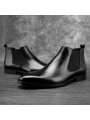 Bottines Chelsea en cuir lisse noir, à enfiler avec élastiques latéraux, bout droit, talon discret et languette arrière.