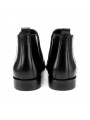 Bottines Chelsea en cuir lisse noir, à enfiler avec élastiques latéraux, bout droit, talon discret et languette arrière.
