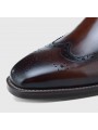 Bottines Chelsea en cuir marron dégradé, à enfiler, avec détails brogues, bout droit et talon.