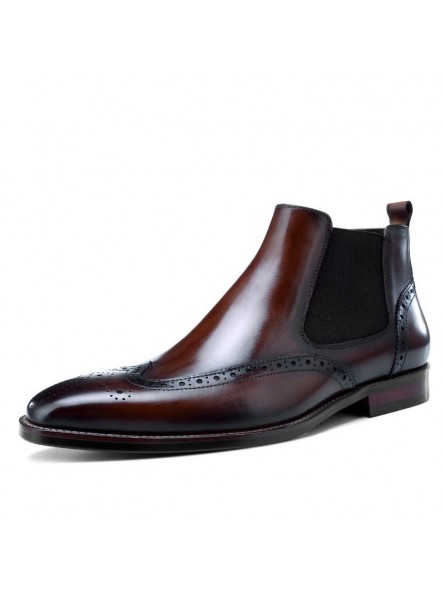 Black leather Chelsea boots with brogue details, side elastics, straight toe and heel. Black leather Chelsea boots with brogue details, side elastics, straight toe and heel.
