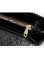 Black quilted-effect grained leather long wallet with flap and snakehead clasp. Two compartments with card slots.