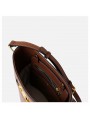 Brown leather bucket bag, with an adjustable and removable leather strap for crossbody wear. Refined gold-tone details.