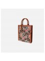 Borsa shopping verticale in jacquard floreale marrone con due manici superiori e chiusura con bottone a pressione.